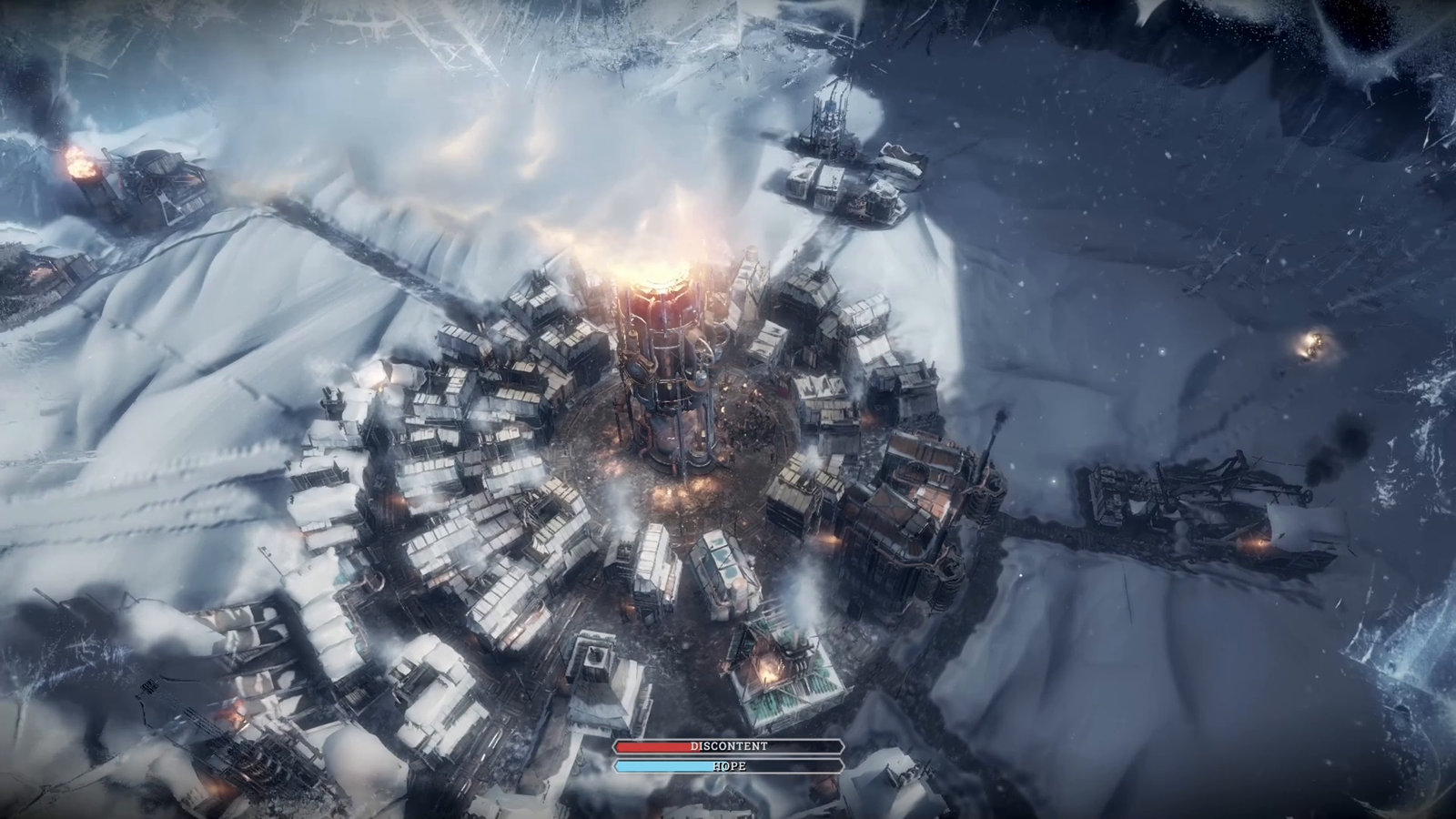 High-angle overall view of the city: the generator tower glows in the center, snow-covered houses stand in rings around it, beyond lies a snowy wasteland and industrial structures